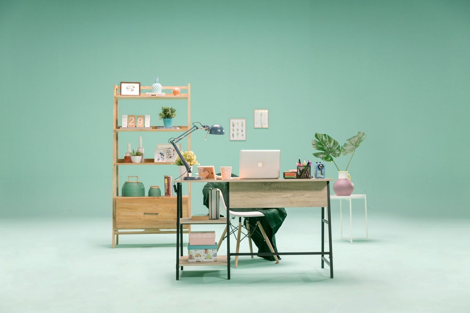 silver macbook on brown wooden table