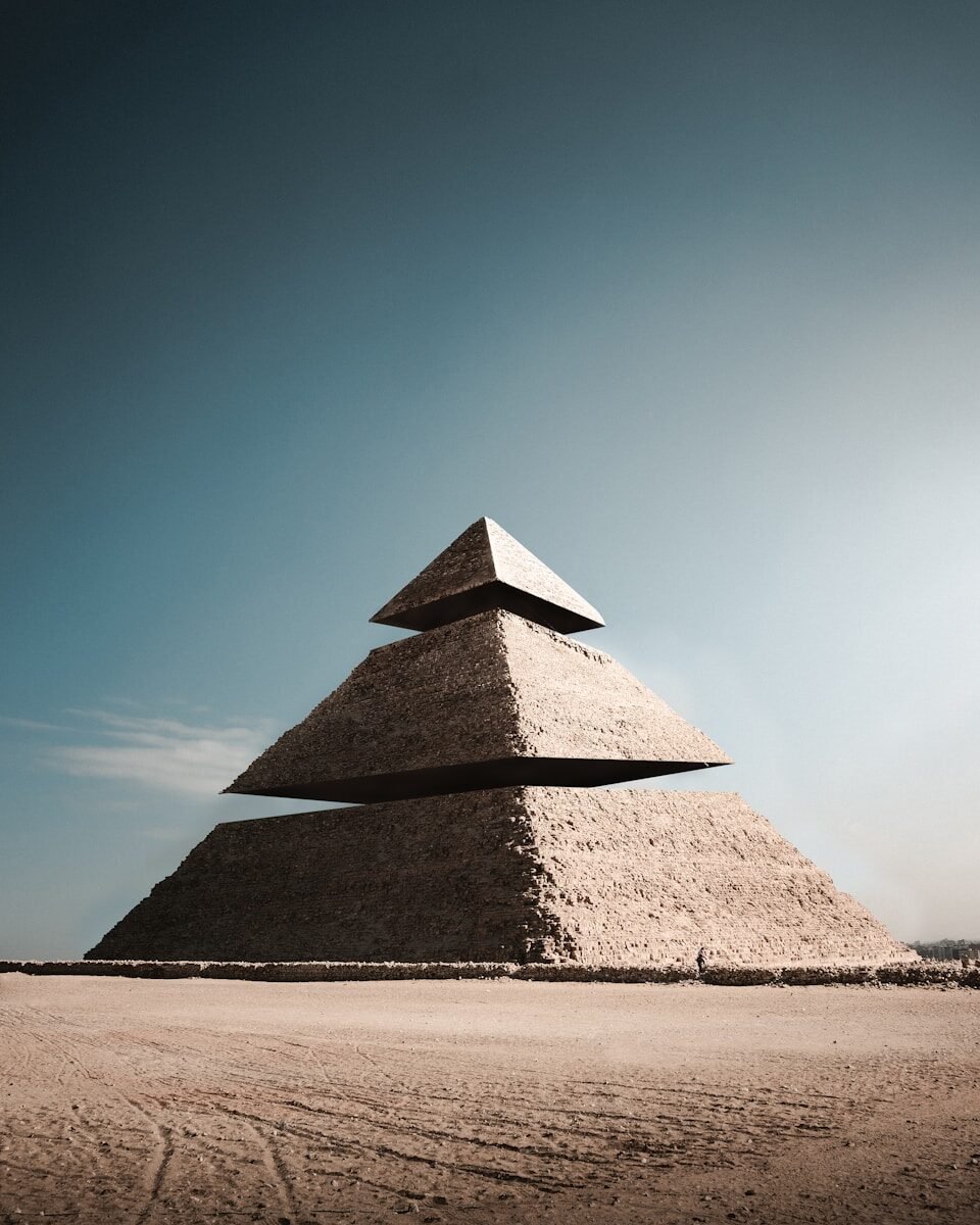 Photo by Eugene Tkachenko pyramid under blue sky during daytime